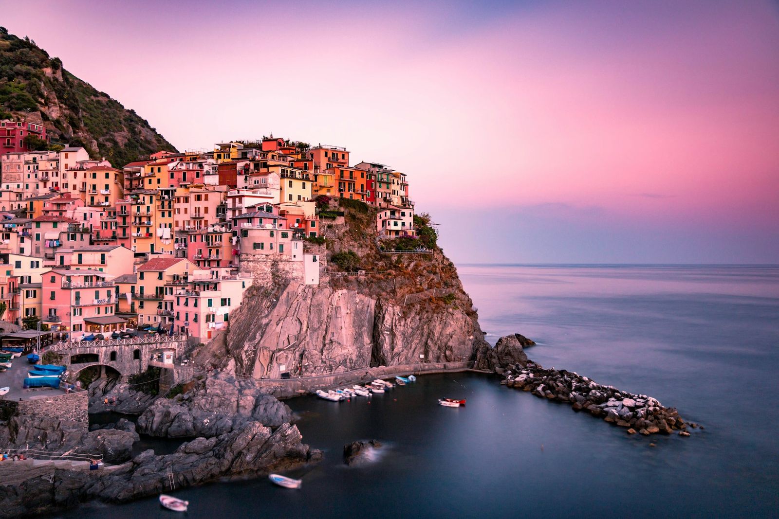 Manarola, a colourful cliffside village above the sea at sunset